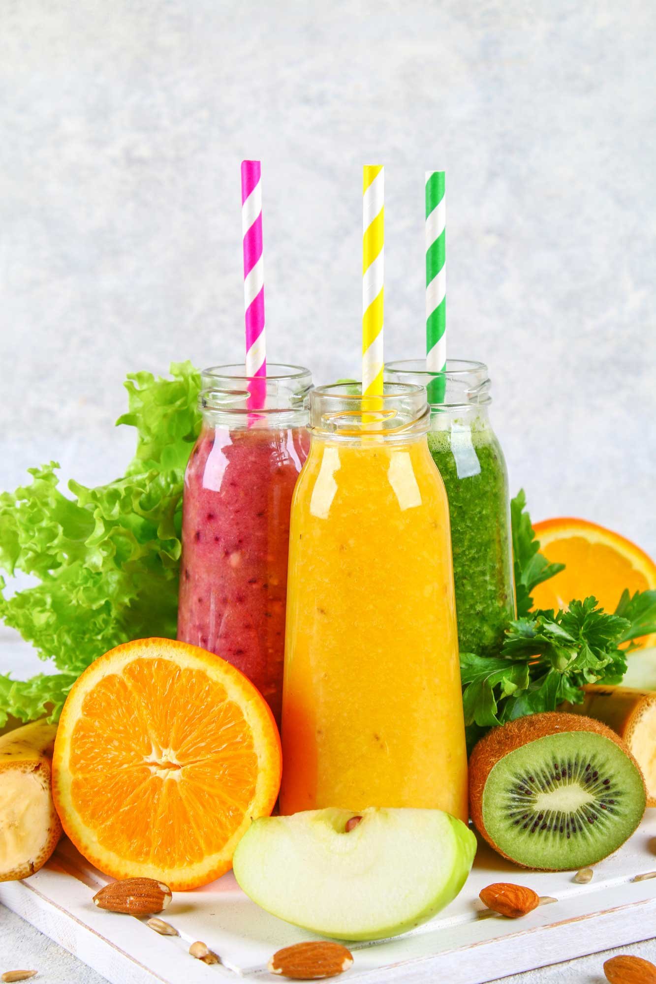 green-yellow-purple-smoothies-currant-bottles-parsley-apple-kiwi-orange